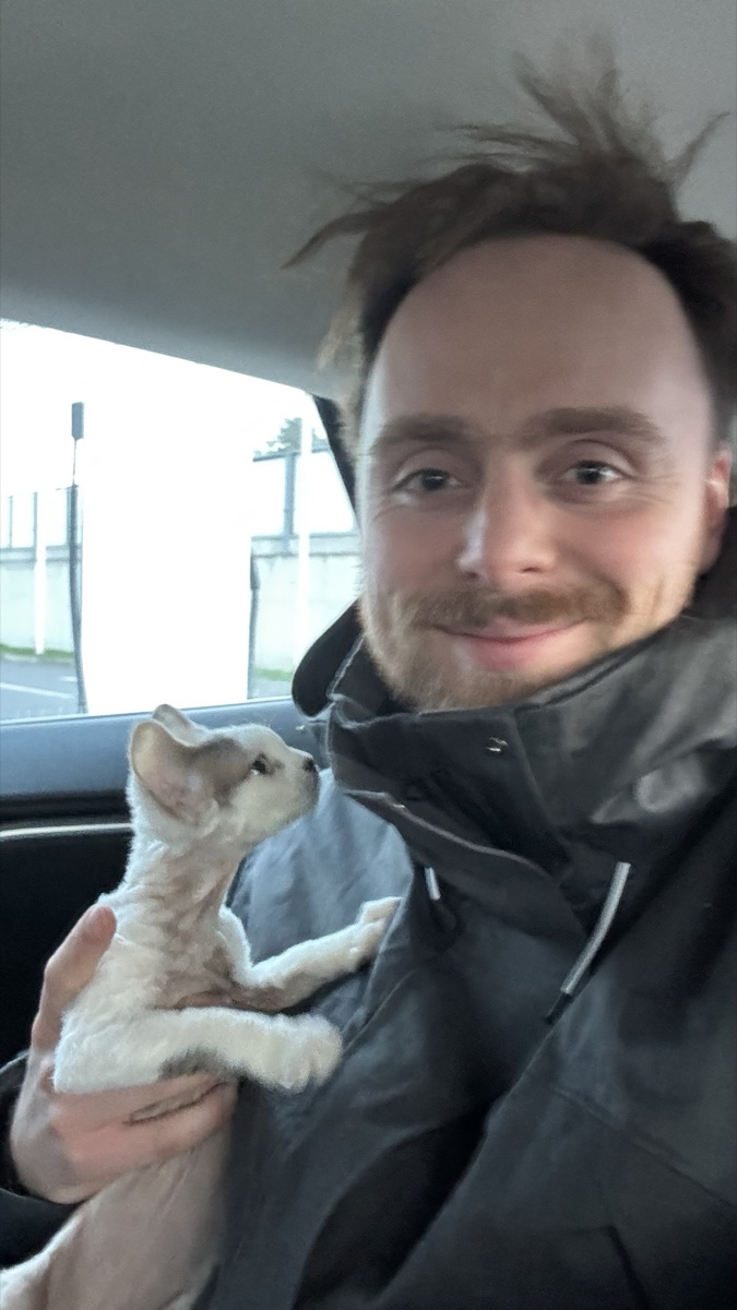 Łukasz with a kitten during a transport